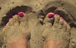 Feet sand sea