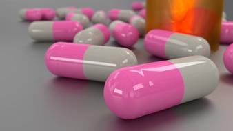 grey and pink capsules