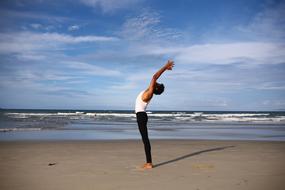 yoga pose on the ocean coast