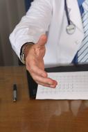 doctor's hands at the table