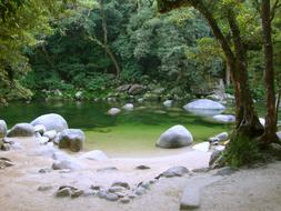white stones on the shore of a tropical reservoir in a national park