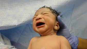 newborn in hands
