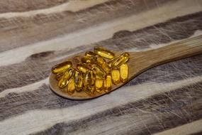 Pills Fish Oil wood spoon