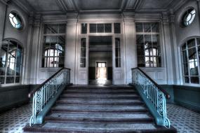 staircase in the hallway of an abandoned house