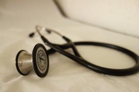 black Stethoscope at abstract background