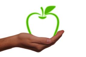 green apple in hand