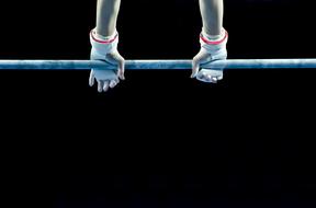 athlete's hands on the horizontal bar