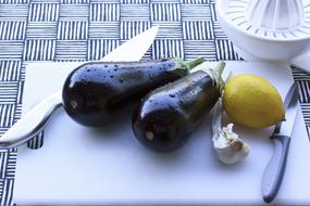 Eggplants, Lemon and Garlic on cutboard