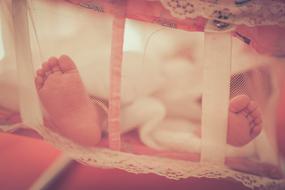 feet of Newborn Baby in crib