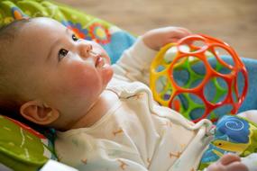 baby with toy ball