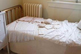 vintage women's clothing on bed in room of Bath House, usa, arkansas, hot springs national park
