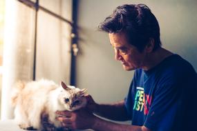 portrait of the man and domestic cat