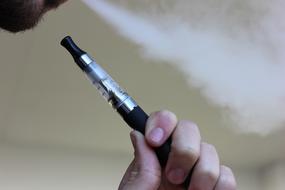 E-Cigarette in male hand, Vaping