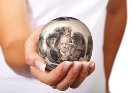 care for the elderly, concept, ball with senior people portraits on female hand