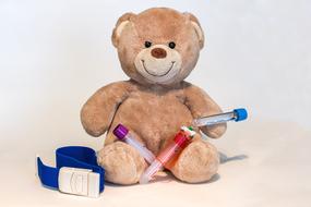 teddy bear with blood collection tubes