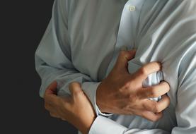 clenched hands on chest