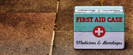 metal first aid kit on the road