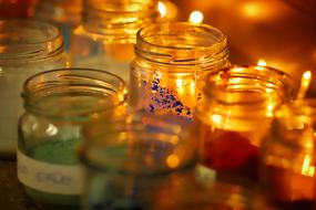 Glass jars at candlelight