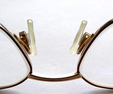 macro photo of reading glasses