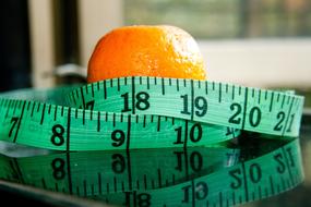 Measuring Tape and orange