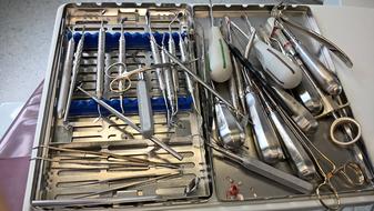 medical instruments on metal trays