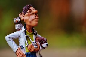 clay figure of Veterinarian with Owl and Animals