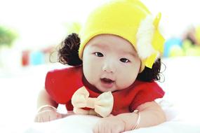 Paternity Baby happy in yellow hat