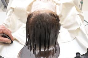 Head Spa, long haired woman taking procedure