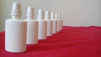 plastic white bottles for Nasal Spray in row