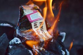 burning cigarette box