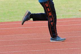 Running person on the stadium track