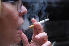 smoking woman in glasses