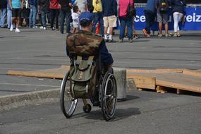 photo of a man on a wheelchair