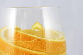 oranges in mineral water in a glass