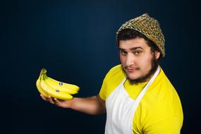 portrait of a man with yellow banana