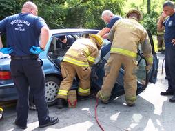 lifeguards cut the car with hydraulic scissors