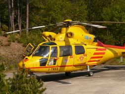 picture of yellow Rescue Helicopter landing