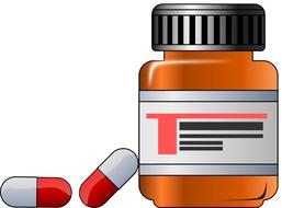 painted medicine bottle and two capsules