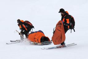 rescue Patrol skiing with load