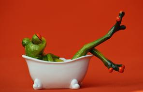 ceramic green Frog Bath Swim red background
