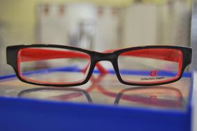 glasses in black red frames on a blurred background