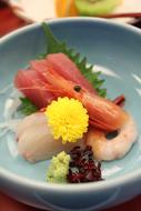 Beautiful Kaiseki dish with colorful decorations in the blue bowl, in Japan