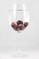 grapes in mineral water in a glass