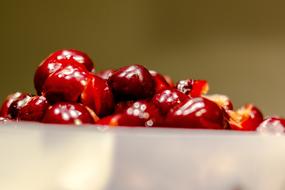 burgundy red cherry in a container