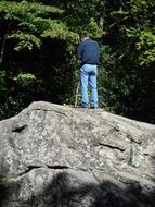 Hiker on rock near River