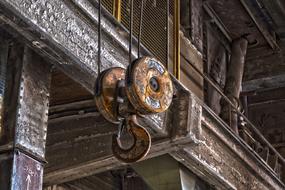 rusty cargo crane in an abandoned factory