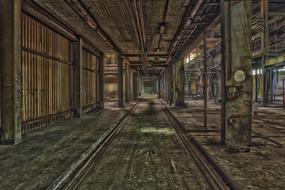 Beautiful, abandoned factory with pillars and graffities