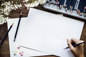 draw with colored pencils on a white sheet