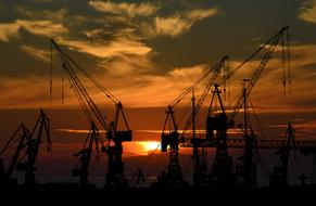 Colorful sunset behind the silhouettes of the port