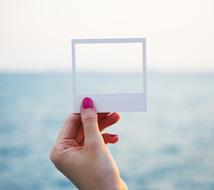 sea in a white frame in hand